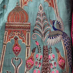Teal lehenga fabric close-up with peacock and arch embroidery in multicolor