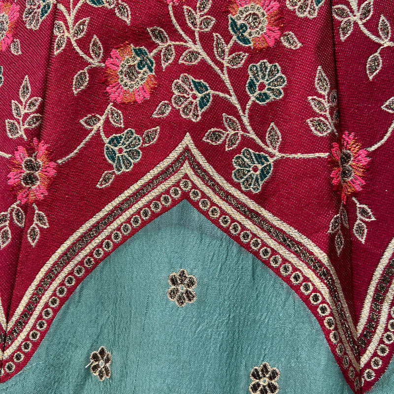 Maroon lehenga panel with embroidered floral vines and teal inner section