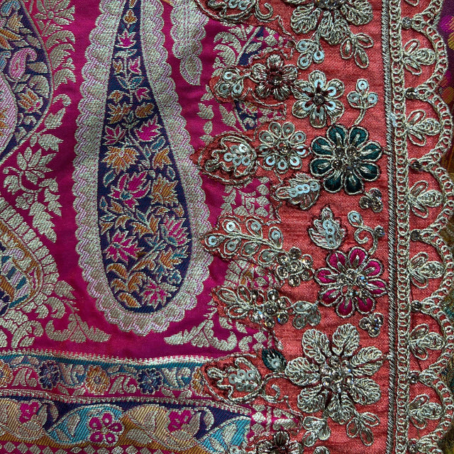 Embroidered lehenga fabric with magenta base and silver floral motifs