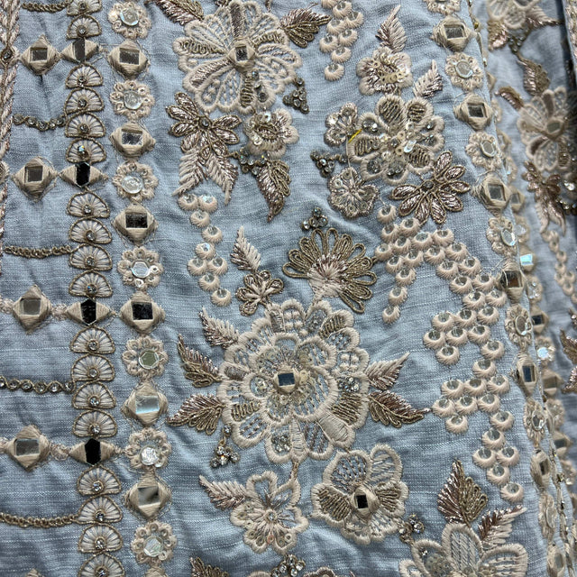 Sky blue lehenga with raw silk finish and dense mirrorwork floral embroidery