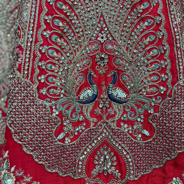 Embroidered red lehenga yoke with peacock motifs and silver beadwork