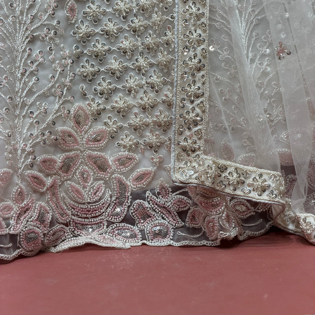 Pearl white beaded floral hem detail on embellished lehenga skirt