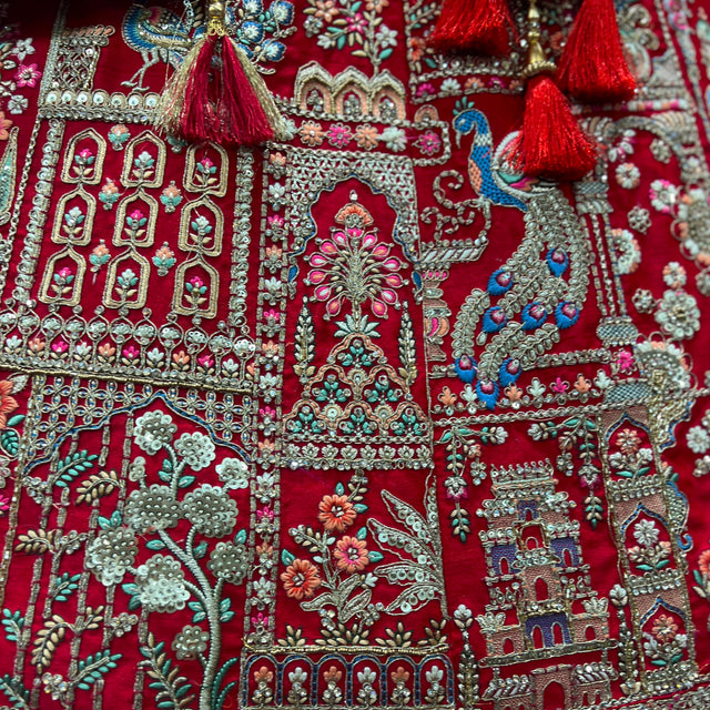 Red embroidered lehenga panel with multicolor beadwork and floral motifs