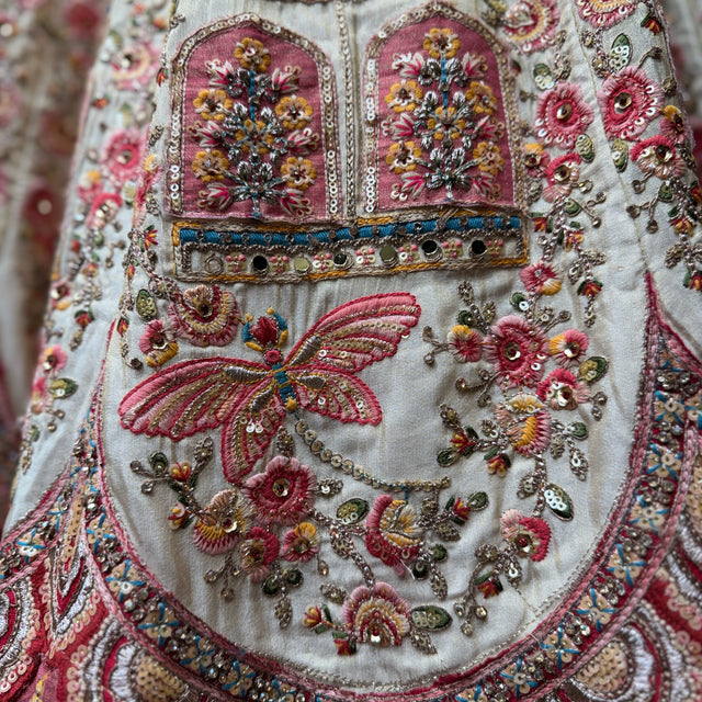 Ivory bridal lehenga with embroidered panel and multicolour beaded motifs