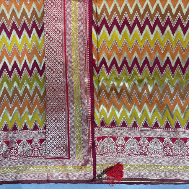 Gold silk saree with zigzag chevron pattern and contrasting border in teal and maroon