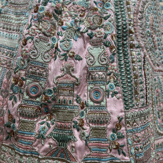 Embroidered soft pink lehenga fabric with teal, gold and beadwork motifs