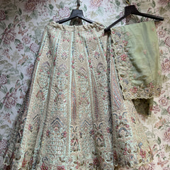 Embroidered bridal dress with sage dupatta overlay and scalloped hem, floral and beadwork