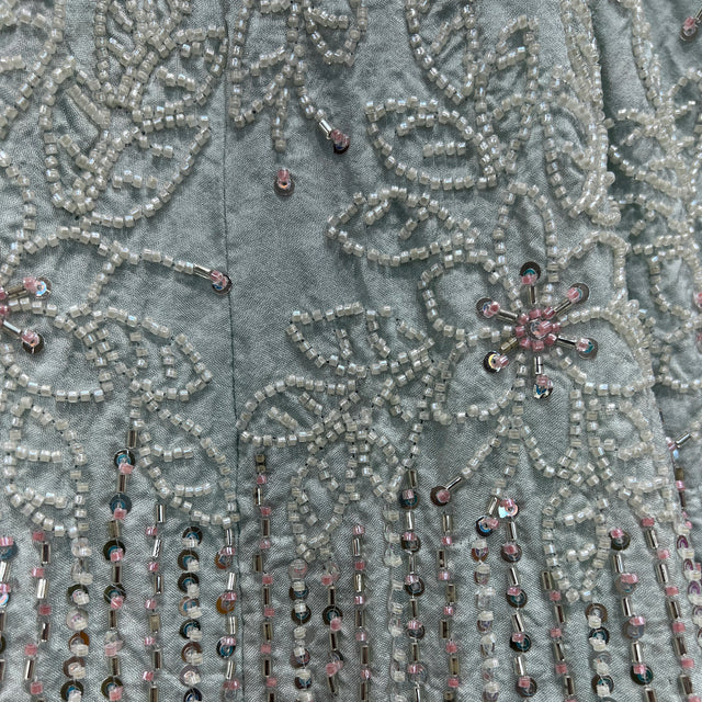 Close-up of powder blue beaded handwork embroidery with silver-toned detailing