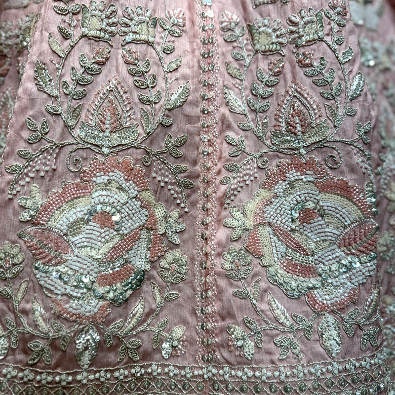 Embroidered pink fabric with beadwork floral motifs, green and silver details