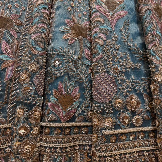 Powder blue fabric with dense multicolor floral bead and sequin embroidery