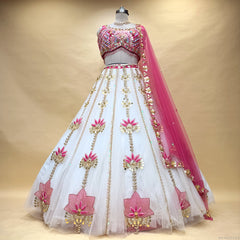 Ivory floral lehenga with embellished pink bodice and matching sheer dupatta