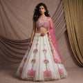 Ivory and pink lotus floral lehenga with embroidered bodice and tulle skirt