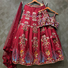 Maroon lehenga and matching blouse with mirror-and-bead embroidery; sheer dupatta