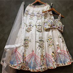 White lehenga set on hangers with mirror bead embroidery and sheer dupatta