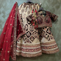 Velvet bridal lehenga with maroon dupatta and ornate silver-toned skirt