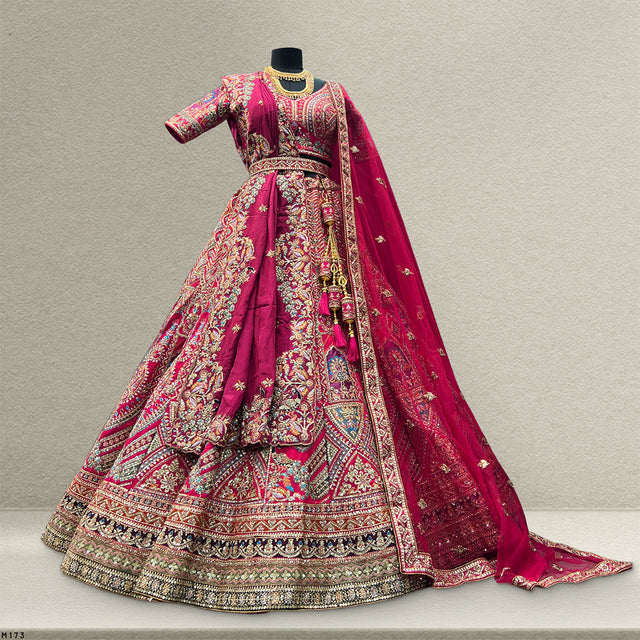 Rani pink bridal lehenga with embroidered flared skirt and draped matching dupatta