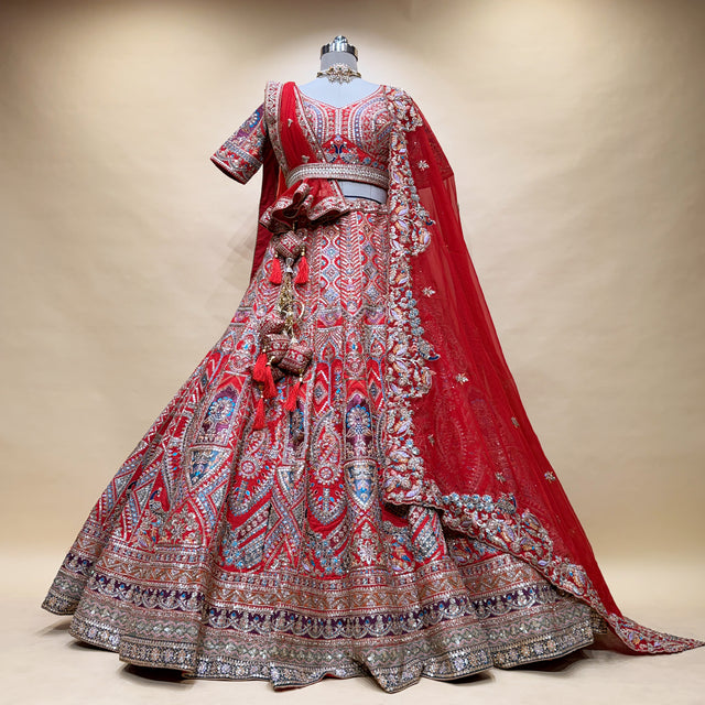Red bridal lehenga with double dupatta, embroidered bodice and full skirt