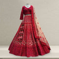 Red embroidered lehenga with matching blouse and long sheer dupatta, ornate beadwork