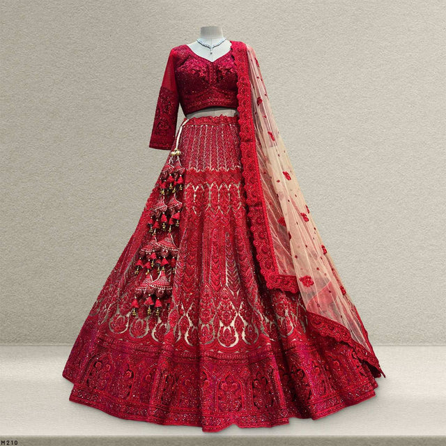 Red embroidered lehenga with matching blouse and long sheer dupatta, ornate beadwork