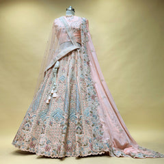 Peach embroidered bridal dress with full skirt and double dupatta, light sheer veil