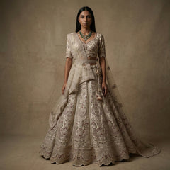 Ivory bridal lehenga with short sleeves and decorative dupatta, detailed mirror-zari work