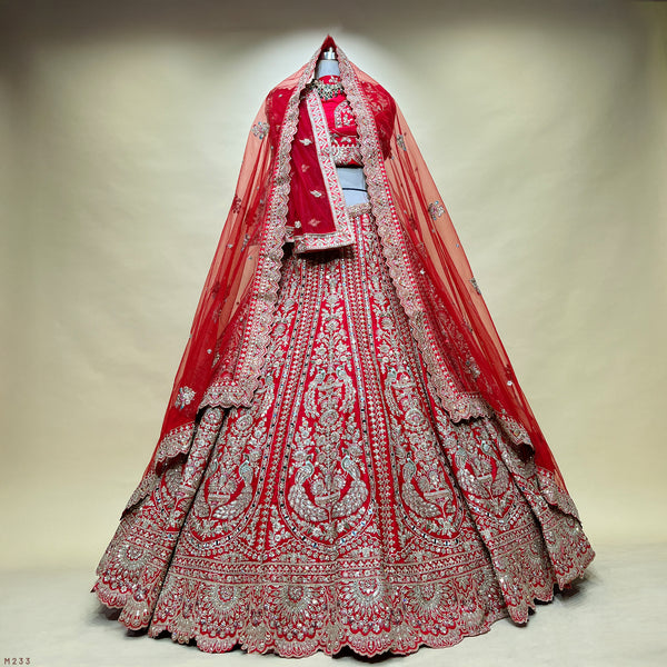 Red bridal lehenga with mirror work, zari peacock motifs and double dupatta