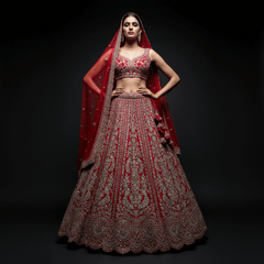 Red bridal lehenga with ornate silver embroidery, flared skirt and matching dupatta