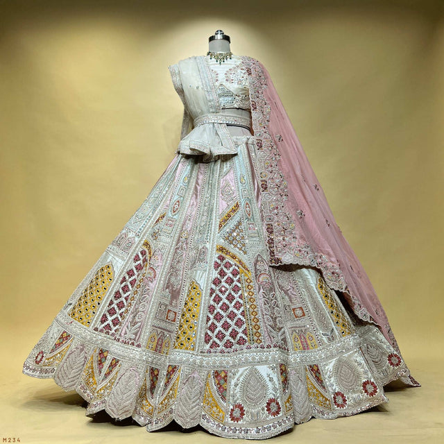Pastel embroidered lehenga with flared skirt and draped mauve dupatta