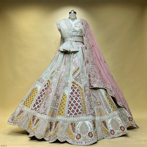 Ivory patchwork lehenga skirt with pleated hem and baby-pink organza dupatta