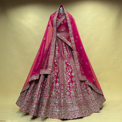 Rani pink bridal lehenga with silver zari and stonework, kalash-style double dupatta