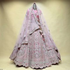 Soft pink lehenga with sheer dupatta and detailed border with paisley embroidery