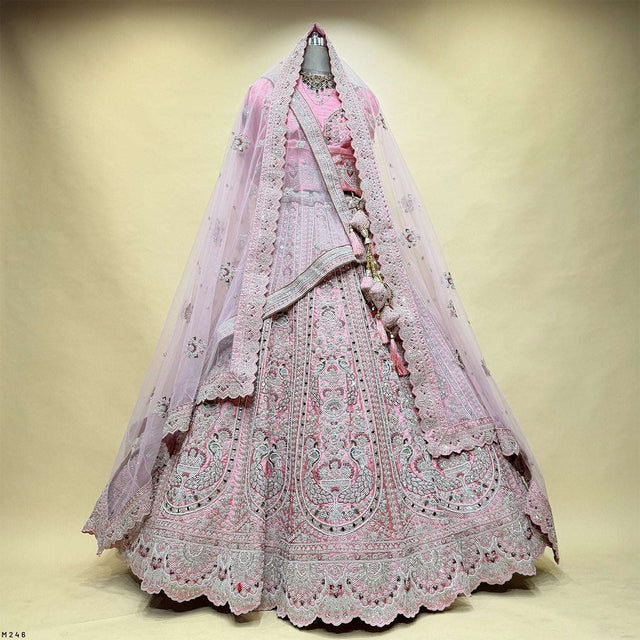 Soft pink bridal lehenga with double dupatta, full skirt lace trim and embroidery
