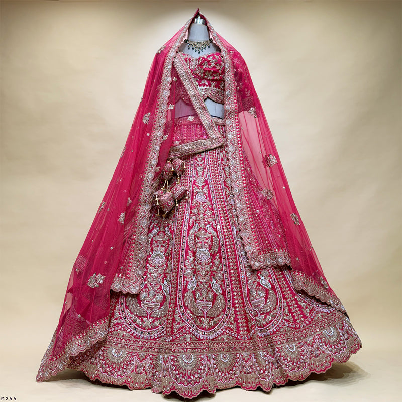 Bridal lehenga choli set with rani pink dupatta and heavily embroidered full skirt