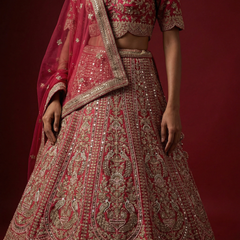 Rani pink lehenga skirt with ornate gold-toned embroidery and matching dupatta