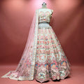 Ivory bridal lehenga skirt with multicolour floral embroidery and pink sheer dupatta