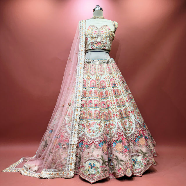 Ivory bridal lehenga skirt with multicolour floral embroidery and pink sheer dupatta
