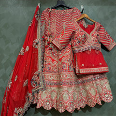 Red bridal lehenga with embroidered blouse, scalloped skirt and red dupatta