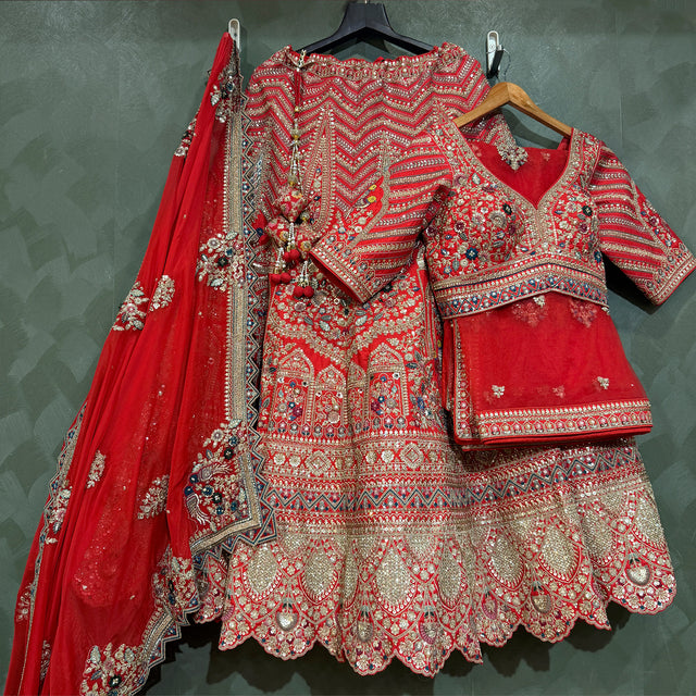 Red bridal lehenga with embroidered blouse, scalloped skirt and red dupatta