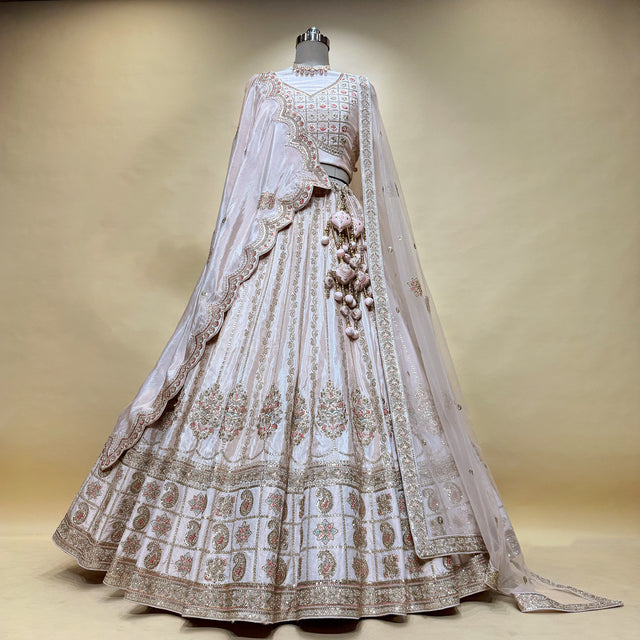 Pastel pink embroidered lehenga skirt with decorative belt and matching dupatta