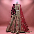 Marwar bridal lehenga with maroon skirt and ornate gold embroidery, matching dupatta