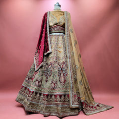 Maroon velvet bridal lehenga with gold zari embroidery and double dupattas, full length
