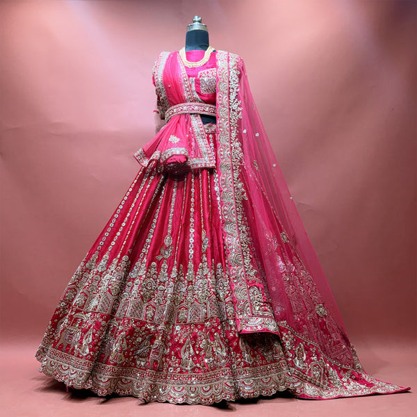 Rani pink bridal lehenga with embroidered bodice and draped net dupatta