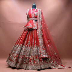 Red raw silk bridal lehenga set with blouse and two net dupattas on mannequin