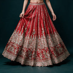 Red raw silk lehenga skirt with sequin medallion columns, embroidered birds and elephant procession border, worn