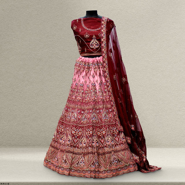 Maroon bodice with pink embroidered tiered lehenga skirt and sheer maroon dupatta