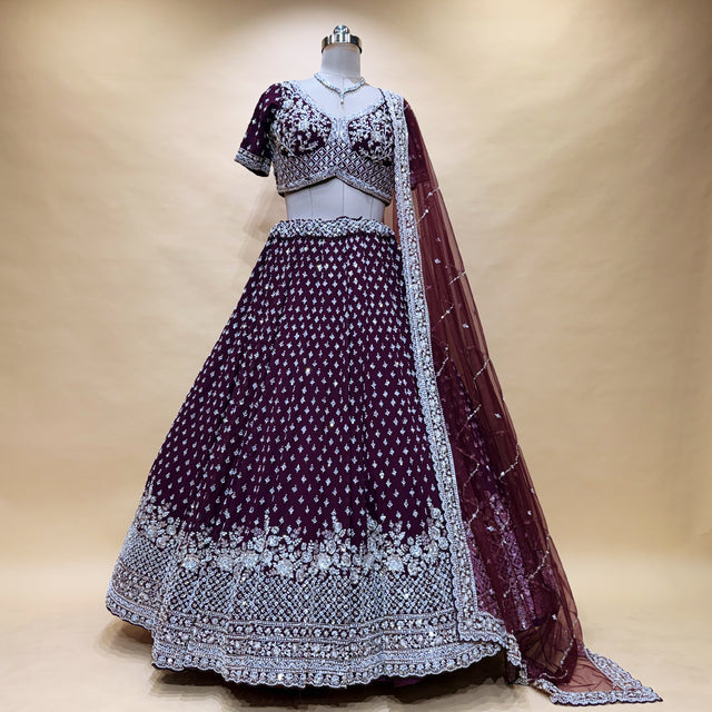 Wine lehenga with silver embroidered yoke, flared skirt hem, and sheer dupatta
