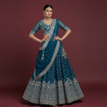 Peacock blue lehenga with silver embroidery, flared skirt and matching dupatta