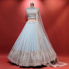 Sky blue lehenga with silver embellished bodice, flared skirt, and sheer dupatta