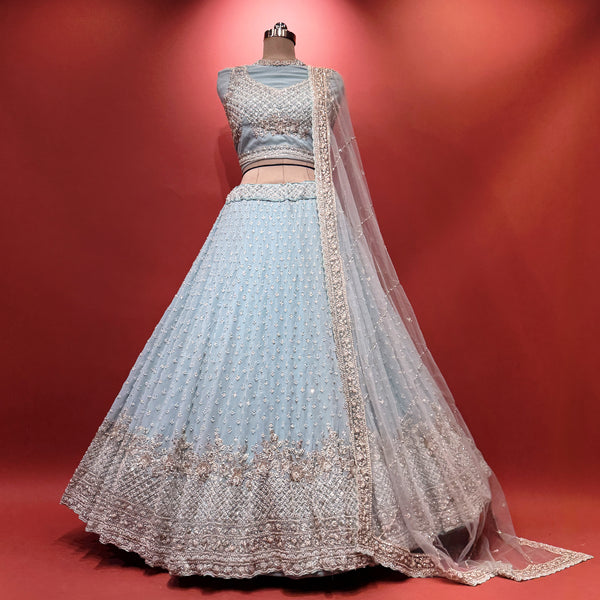 Sky blue lehenga with silver embellished bodice, flared skirt, and sheer dupatta