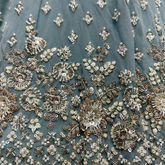 Sky blue georgette lehenga with silver cutdana floral buti and embellished hem